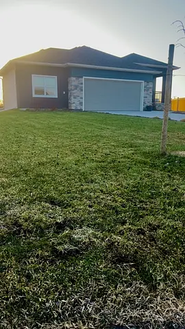 Lawn after core aeration in front of a new home