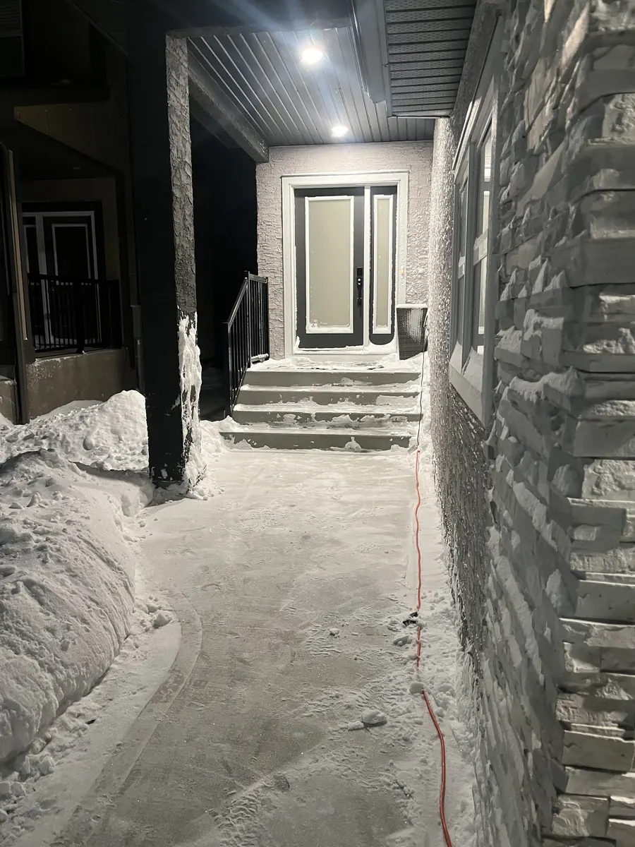 Same walkway and steps cleared at night by Precision Same walkway and steps cleared at night by Precision